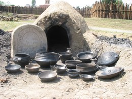 The smaller kiln was used for pots of more modest size. The entire firing cycle, in which temperatures can rise to 800 degrees, takes several hours and requires constant supervision of the fuel and airflow.
