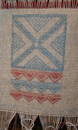 Various tones of blue have been obtained from woad. The textiles created on the looms at Montale have been decorated with motifs deriving from pots uncovered at the terramare. Brocade technique was employed.